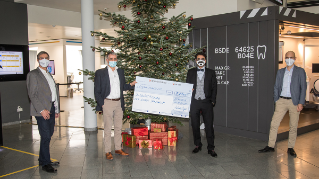 Dentsply Sirona employees hand over donations