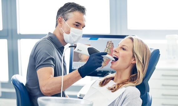 Dentist taking digital impression with Primescan