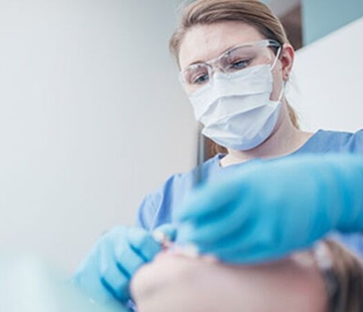 Dental Professional Applying Dental Cement